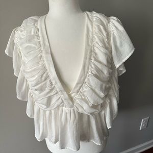 Vici white ruffled deep v neck blouse. Open back zips on the side size XL